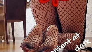 Blonde in fishnets shows her wet pussy and bubble butt