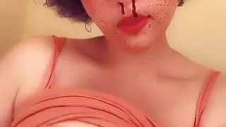 Kitty slut plays with her big boobs