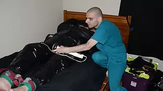 Jun 14 2022 - Rubber boy has a good time with the vibe in his leather straitjacket