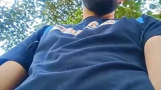 Big uncut cock latino jerking outdoors in the woods and eating his tasty cum careful not to get caught