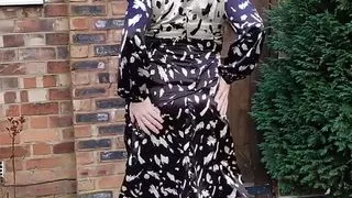 Pink haired crossdresser in sexy back satin dres