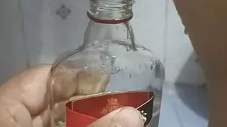 Bhabi pissing in rum bottle