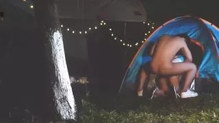 Big-breasted beauty enjoying sex on nature's meadows while camping