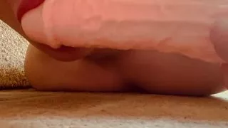 Sucking a dildo while getting fucked from behind