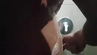 Young Latino takes a long shower and then starts touching his dark-haired body and masturbating