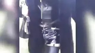 The sissy slut out for a walk in an all-vinyl outfit (stockings, garter belt, mini-skirt, bustier...,)