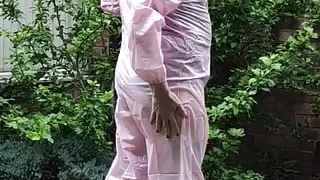 Tranny slut in pink PVC boiler suit outdoors