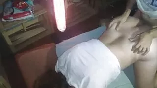 As a puppy with a white shirt, between drawers and an electric stove