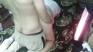 With a gray road thong and a white shirt in bed at night