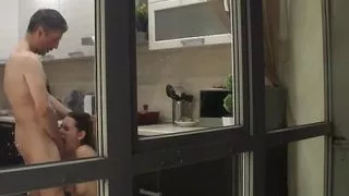 Watching my stepdad destroying my stepsister's pussy in the kitchen