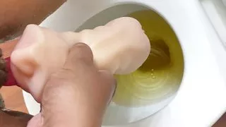 Nasty Ebony pissing and masturbating in pocket pussy mouth