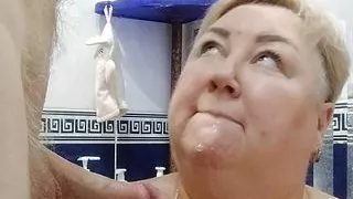 I take the golden rain on my chest and suck his cock