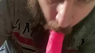 Sucking on a dildo