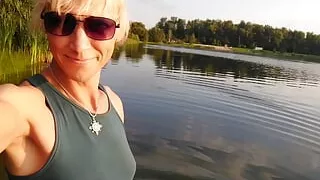 Swimming in the lake in sport wear at sunset.. Wet leggings and t-shirt...