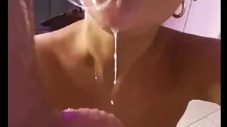 Milf sucks off a big rubber dick