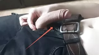 A guy in clothes jerks off his dick