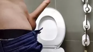 Man showing off his big dick in public restroom