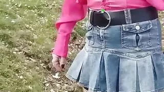 sissy walks around in denim mini skirt and shows her ass and penis in her chastity cage