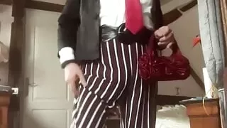 In uniform with striped pants