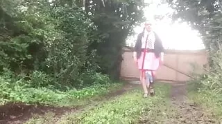 In school attire with a pink pleated skirt on the outside