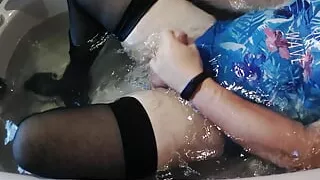 Boy in stockings and swimsuit jerking