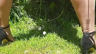 Vintage lady's outdoor kinky lingerie and masturbation show - including seamed nylon stockings and vintage panties.