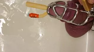 Pissing with catheter locked in chastity cage