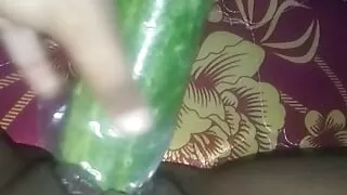 Busty slut inserts cucumber in her cunt