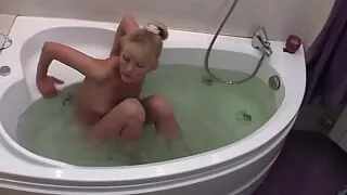 my naughty girlfriend  enjoying a refreshing moment naked in the bathtub