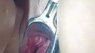 My hot wife's pussy is spread wide open by a speculum.