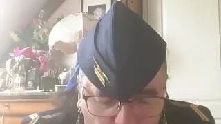 In an aviator outfit with a hook in my ass chained to my necklace to suck a dildo