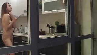 Watching my neighbour's naked sexy girlfriend goofing around in the kitchen