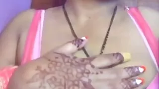 The Girl Shows Her Boobs Out of the Bra and Also Presses Her Boobs