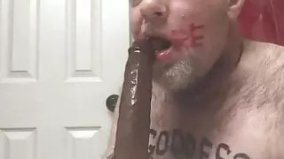 Exposed faggot Christopher Allen Foster deepthroats black rubber dong