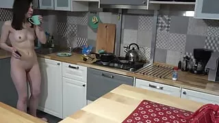 Stunning brunnette makes breaskfast in the kitchen completely nude