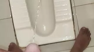 Indian Boy pissing in Toilet and Masturbating