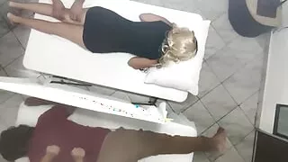 Erotic Massage on the Body of the Beautiful Wife Next to Her Husband in the Couples Massage Salon It Was Recorded