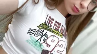 Cute brunette shows her breasts on the street