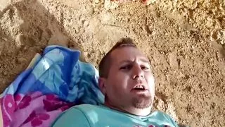 Good looking German blonde pleasing a loaded cock outdoors