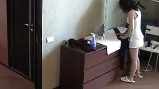 Petite dame ironing her clothes nude in the house