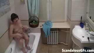 Solo teen masturbates in the shower