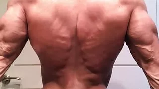 Jacked bodybuilder Benji Bastian flexing his huge, shredded, muscles