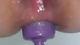 Inserting the water bottle into my ass