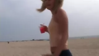 Petite teen masturbating on the beach