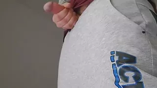 The cum falls in heavy drops onto the floor. Milking my dick