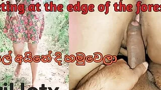 The fun of the Asian couple meeting at the edge of the forest