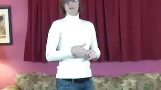 Horny red-haired babe takes her clothes off and puts her body on display