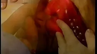 Sexy little whore wraps her lips around two hard cocks