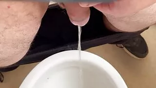 Pissing in toilet