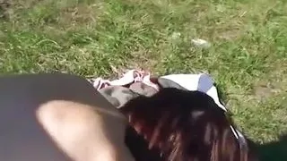 Brunette MILF with glasses loves sucking cock on her knees out in the fields